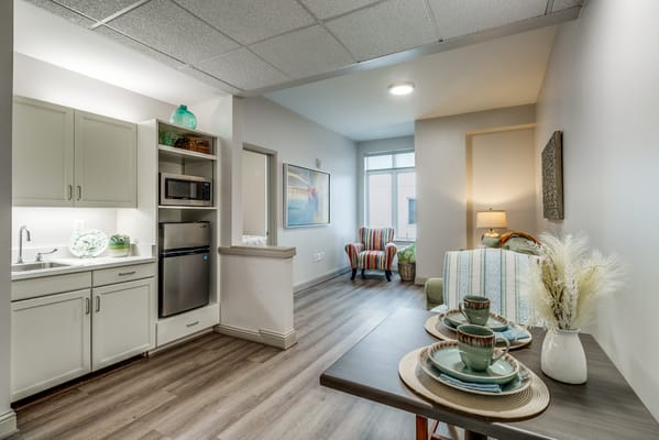 Bright interior view of a living space with kitchenette