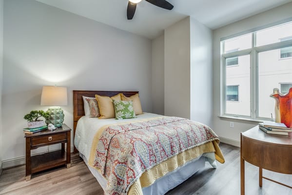 Cozy private bedroom with natural light and decor