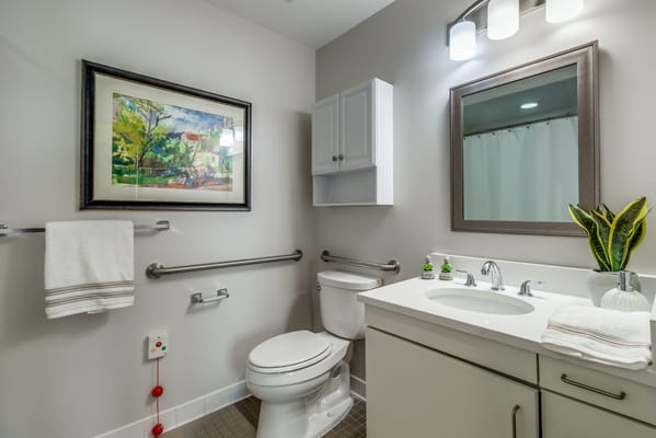 Well-lit bathroom with modern fixtures and decor