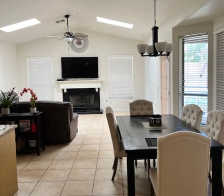 Interior view of a bright common area with dining table