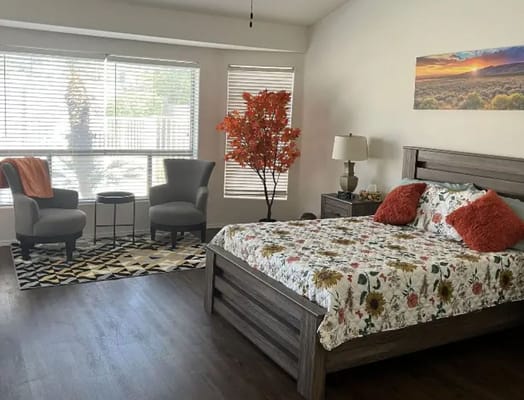 Bright, well-decorated resident room with natural light