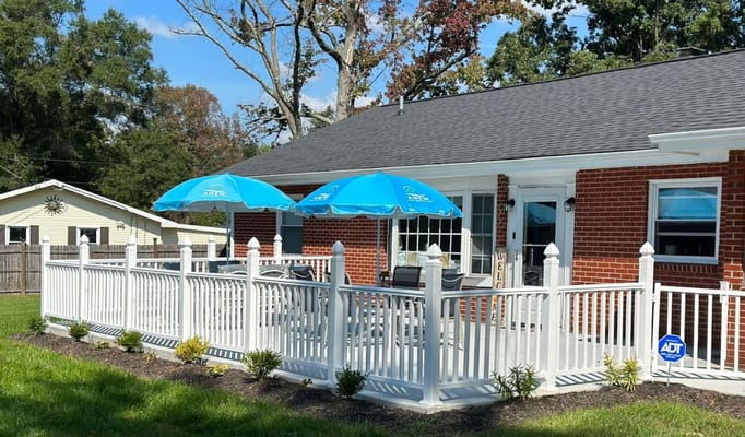 Outdoor seating area with blue umbrellas
