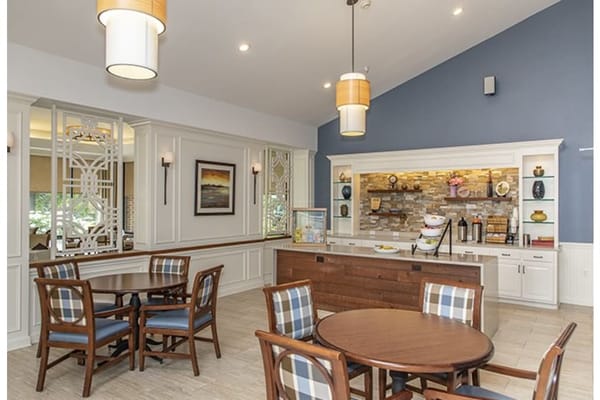 Bright common area with tables and decor