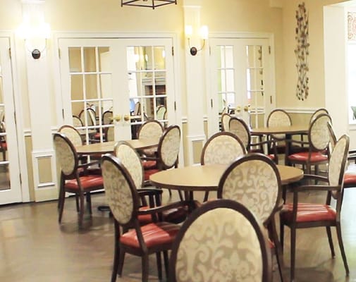 Interior view of a dining area with tables and chairs