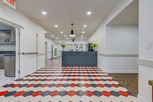 Interior view of a common area with colorful flooring