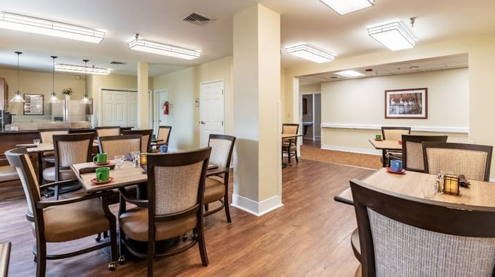 Interior view of a dining room with tables and chairs