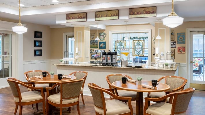 Bright dining area with tables and coffee station