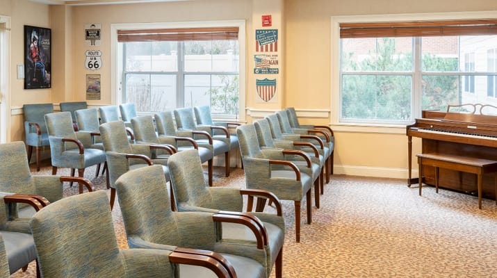 Interior view of a common area with seating and a piano