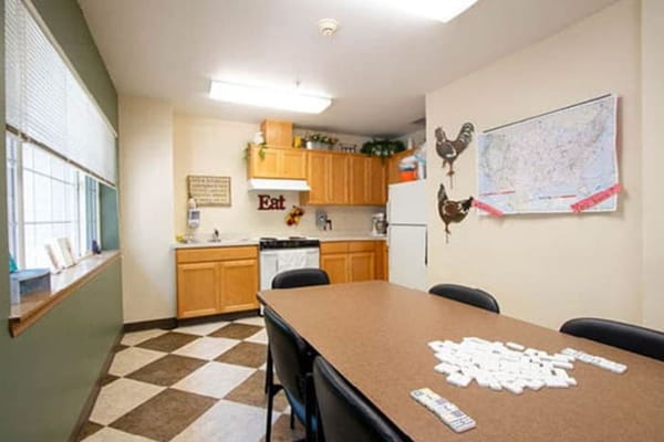 Common area kitchen with dining table and decor