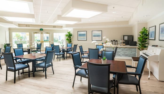 Bright dining area with tables and chairs