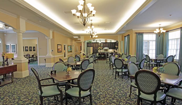 Bright dining room with tables and chairs