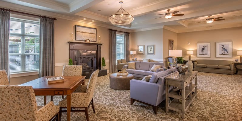 Bright common area with seating and dining table