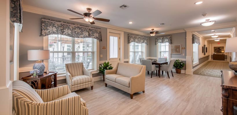 Bright common area with seating and natural light