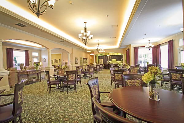 Interior view of a dining room with tables and chairs