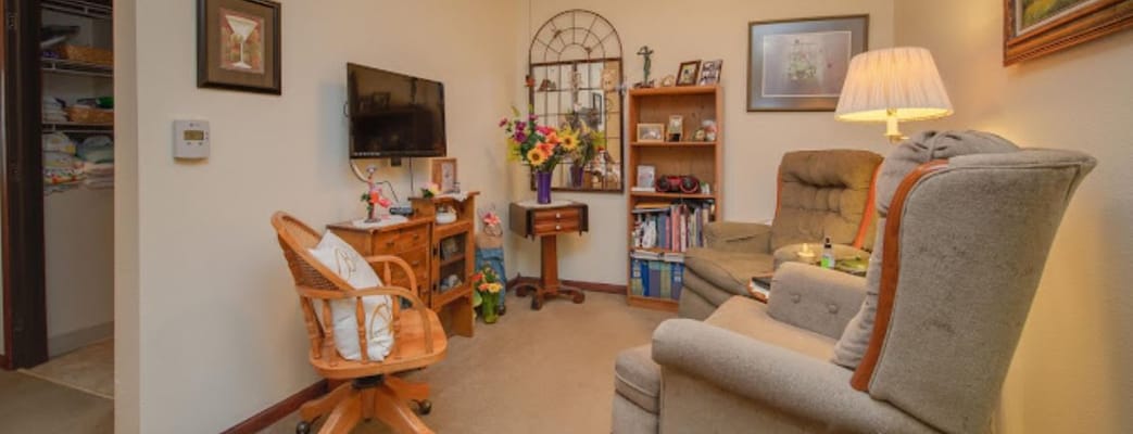 Cozy resident room with comfortable seating and decor