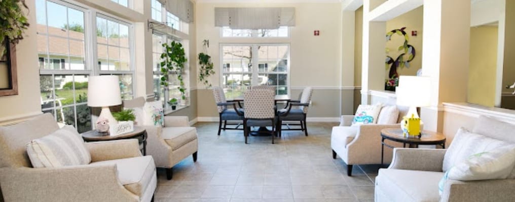 Bright common area with seating and dining table
