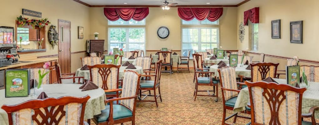 Dining room with tables and chairs set for a meal