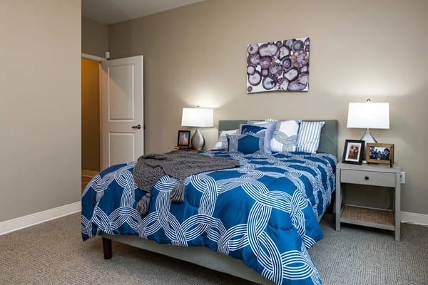 Cozy bedroom setup with decorative bedding