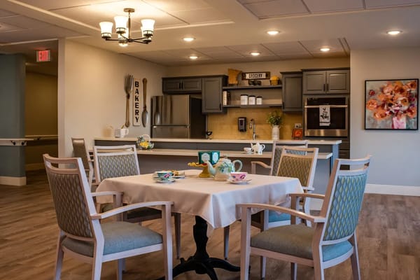 Bright dining area with table settings and bakery theme