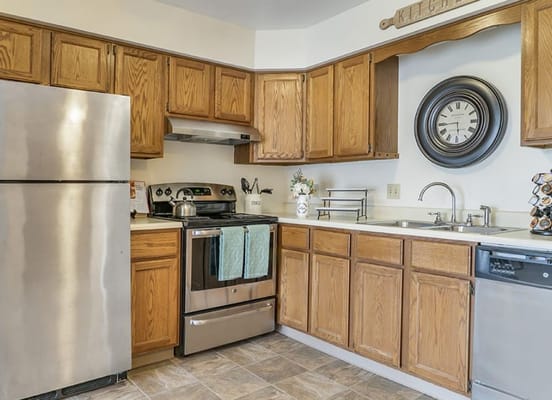 Modern kitchen interior with wooden cabinets and appliances