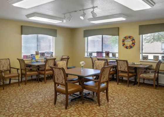 Bright common area with tables and chairs