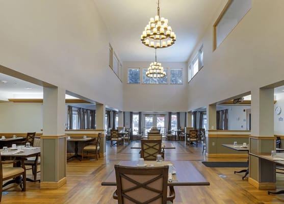 Bright dining area with elegant lighting and furnishings