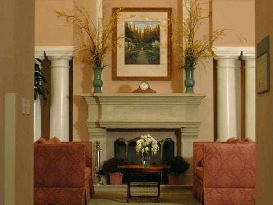 Interior view of a cozy common area with a fireplace