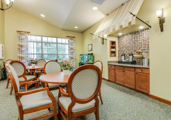 Cozy dining area with wooden tables and chairs