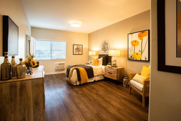 Cozy resident room with warm decor and natural light