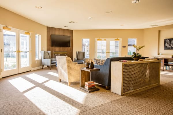 Bright common area with comfortable seating and natural lighting