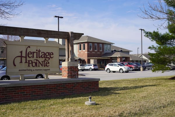 Signage with the facility name and support statement