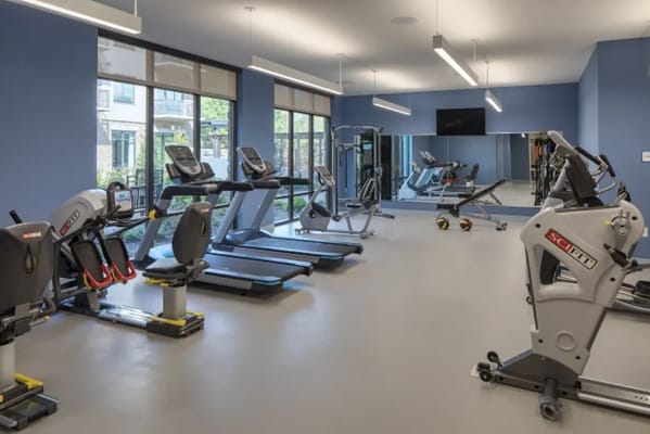A modern fitness room with exercise equipment