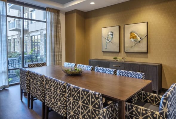 Bright common area with modern decor and large windows