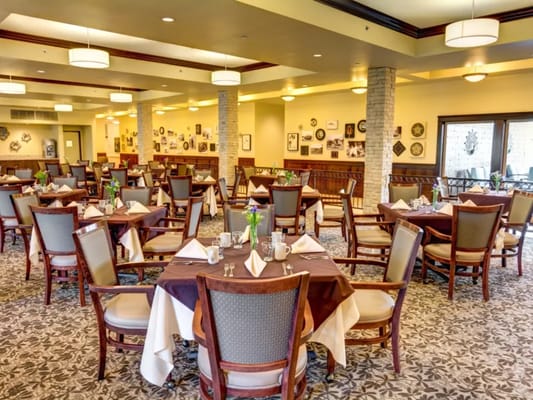 Dining room with tables set for residents
