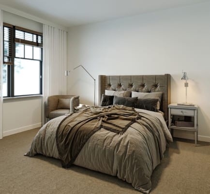 Well-appointed bedroom with a comfortable bed and seating area