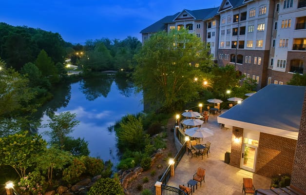 Beautiful outdoor area with seating and a pond view