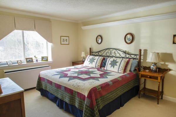 Comfortable resident room with a neatly made bed