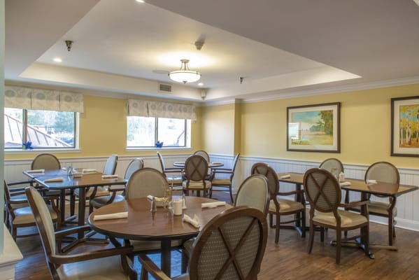 Bright dining area with tables and chairs