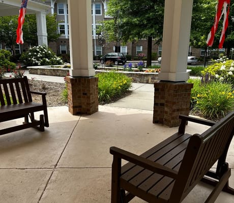 Outdoor seating area with gardens and flowers