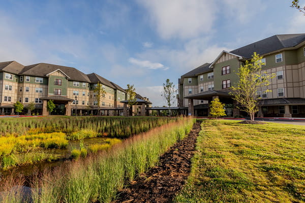 Exterior of Givens Gerber Park senior living facility with landscaped greenery