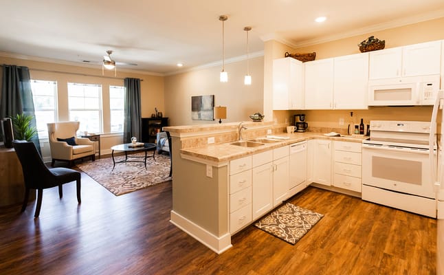 Light-filled kitchen and living space in a senior living facility