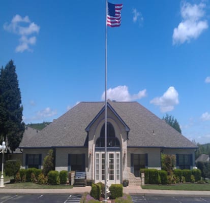 Exterior view of Golden Years Retirement Village with flag