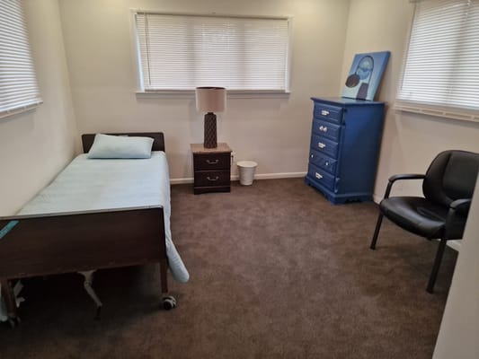 A private resident room with simple furnishings