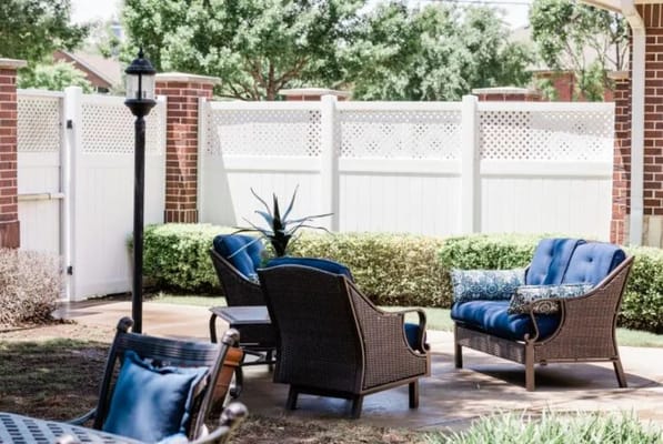 Outdoor seating area with chairs and plants
