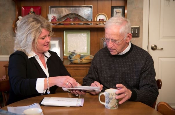 Staff member engaging with a resident at a table