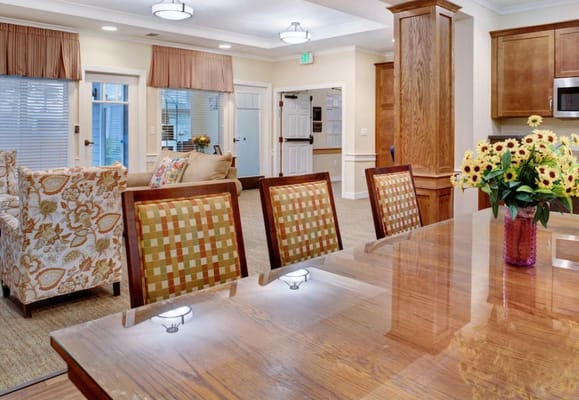 An inviting common area with comfortable seating and flowers