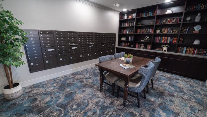 Cozy seating area with mailboxes and bookshelves