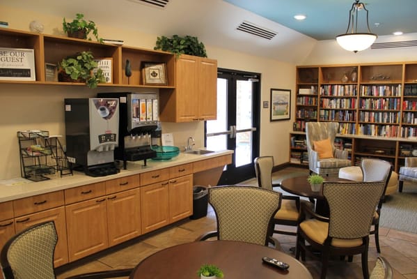 Interior view of a cozy common area with bookshelves