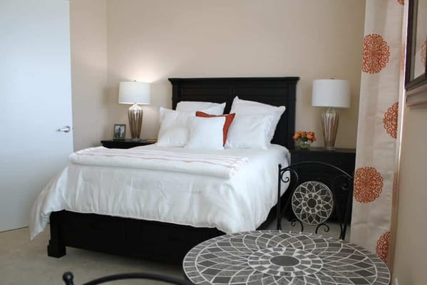 Well-furnished private resident room with a bed and a table