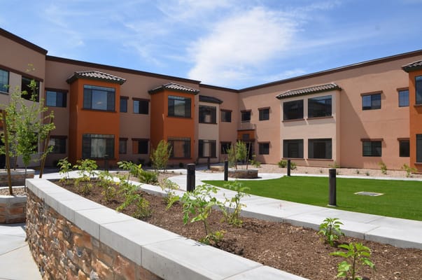 Outdoor courtyard with landscaping and building façade